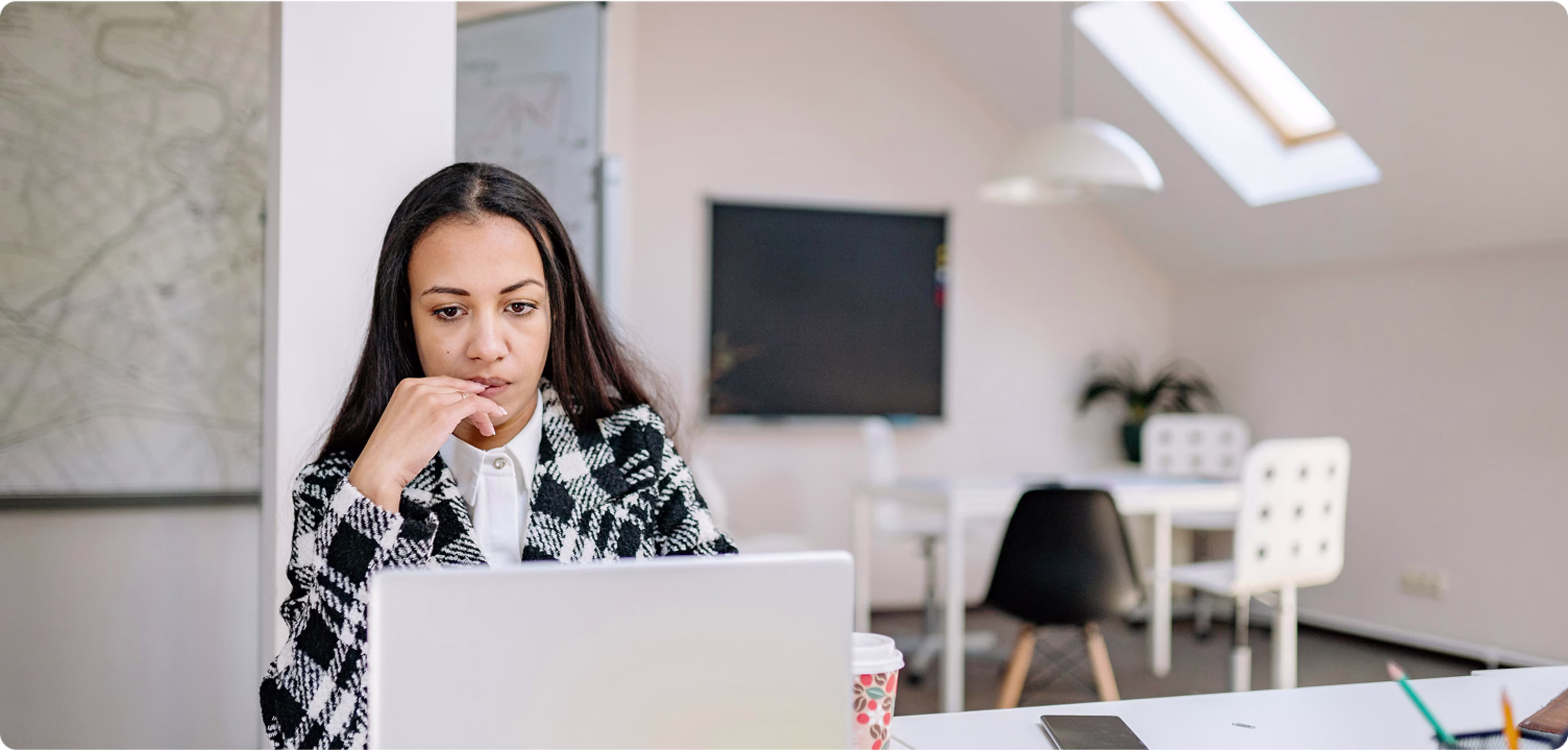 Woman looking at laptop